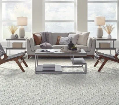 A stunning living room with light colored, patterned carpet
