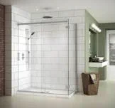 A shower with tile flooring inside a remodeled bathroom