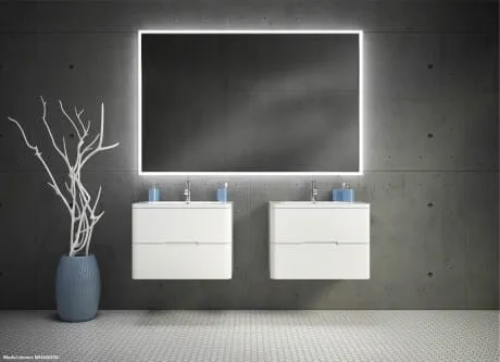 Backlit LED mirror in bathroom with two white vanities