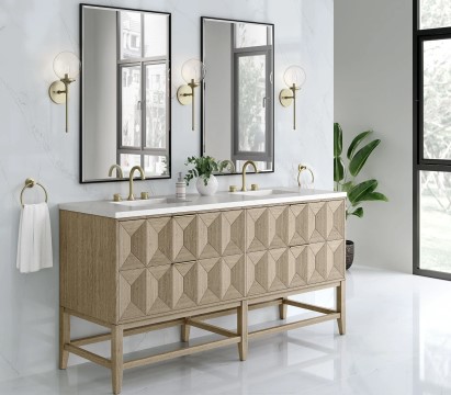 Mirrored vanity with white countertops in a bathroom
