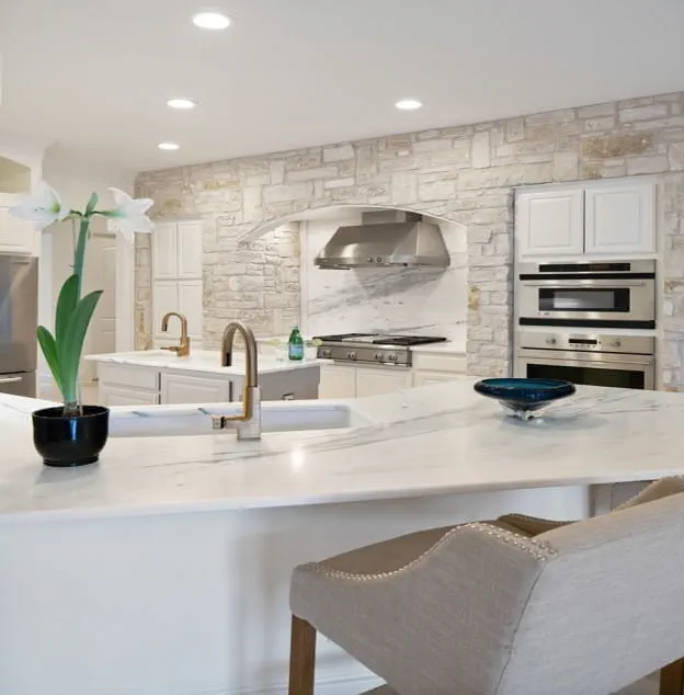 A remodeled kitchen with quartz countertops
