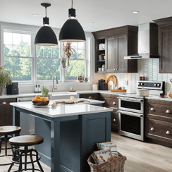 A remodeled kitchen with dark wood cabinets