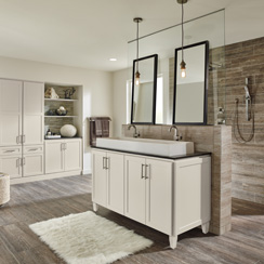 A remodeled bathroom with a white vanity