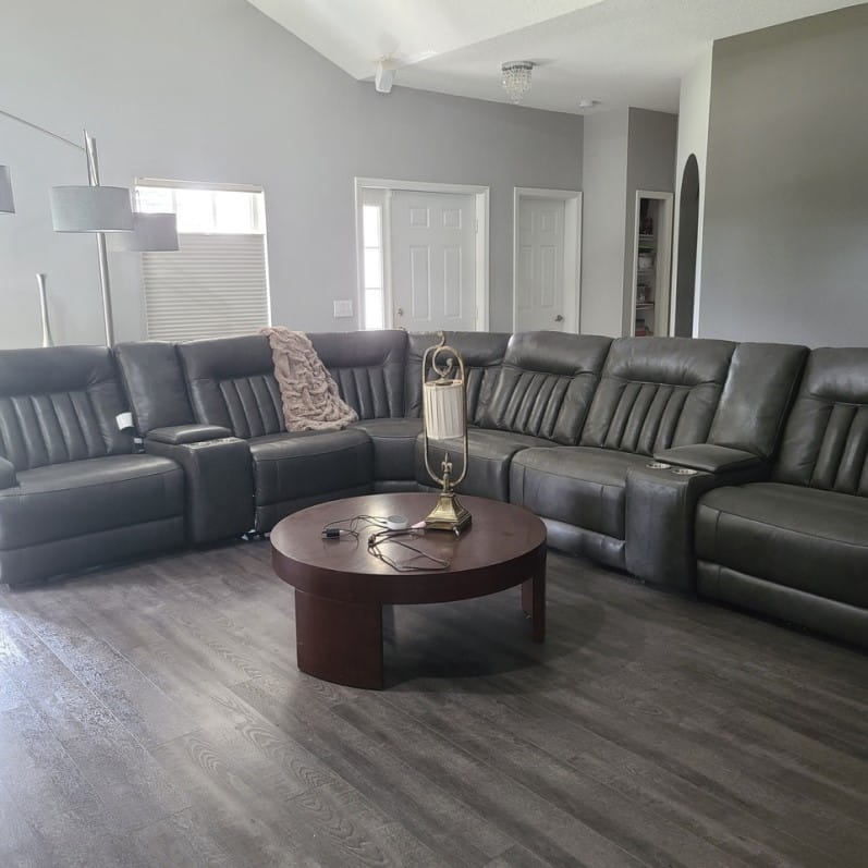 Luxury vinyl plank flooring under a living room couch
