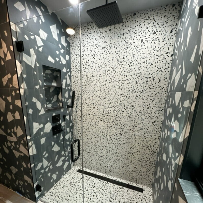 Complimenting dark and light tile in a remodeled shower