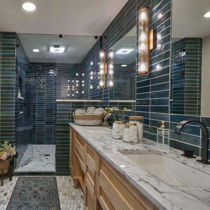 A bathroom remodel with blue wall tile