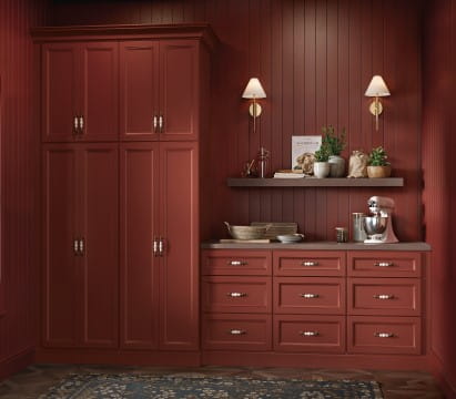 Painted cabinets are seen in a butler's pantry 411x360