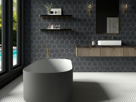 Modern bathroom featuring a freestanding oval bathtub...