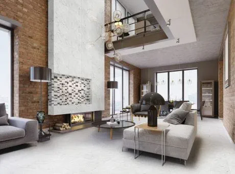 Modern living room with contemporary furniture, decorative lighting, brick walls, and fireplace with marble and mosaic tiles.