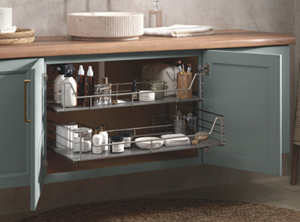 Open cabinet with organized shelves under a wooden countertop, containing household items and toiletries.