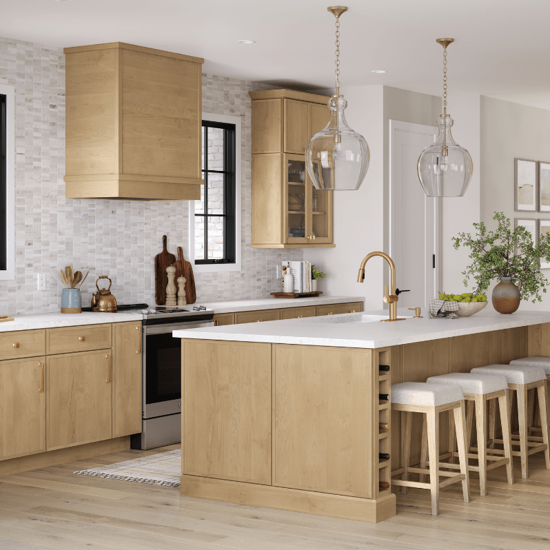 Kitchen with natural wood cabinets, large island, and light mosaic tile backsplash.