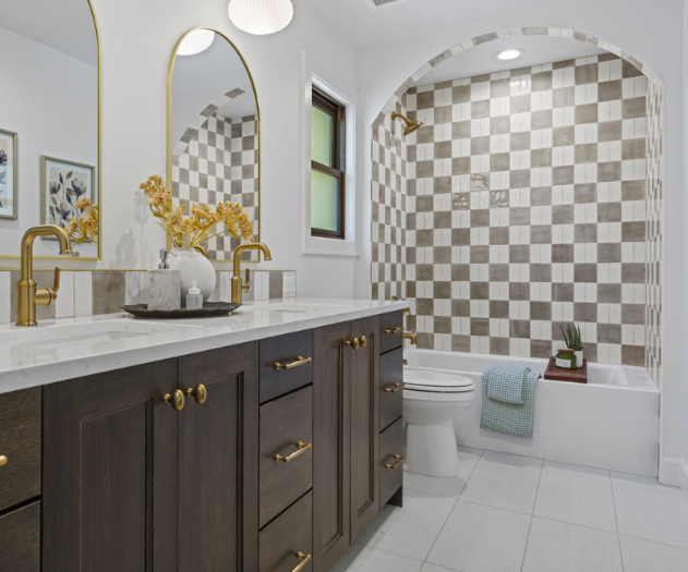 Zalaja Glossy tiles in a checkered pattern on an accent wall in the shower and Surface Art Bespoke on the floor