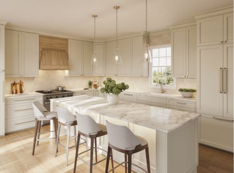 Modern kitchen with marble countertop island, cream cabinetry, wooden stools, and pendant lighting.