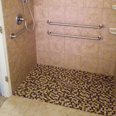 Remodeled shower with tiled walls and floors
