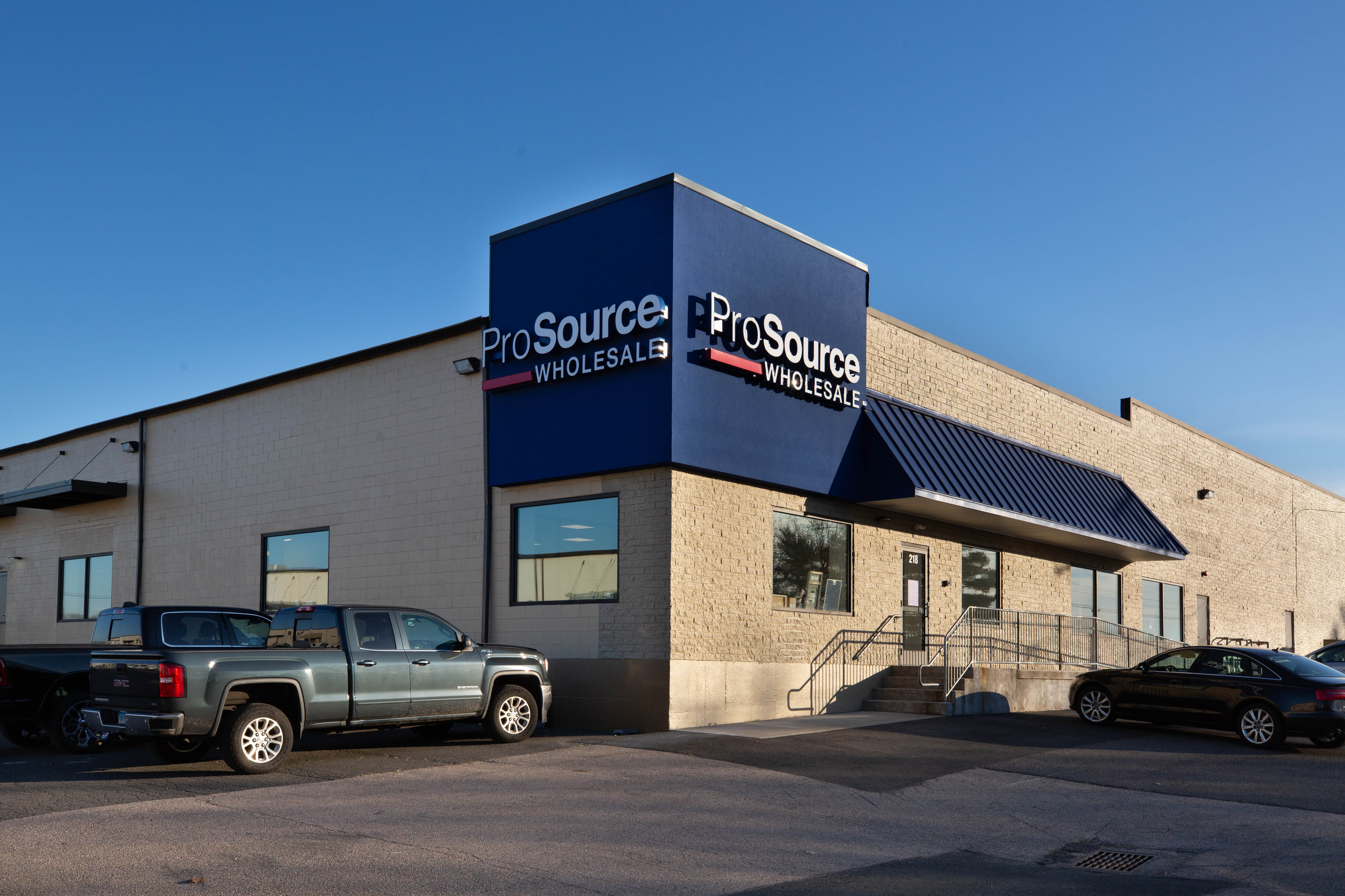 Exterior of the ProSource Wholesale building with parking and entrance shown.