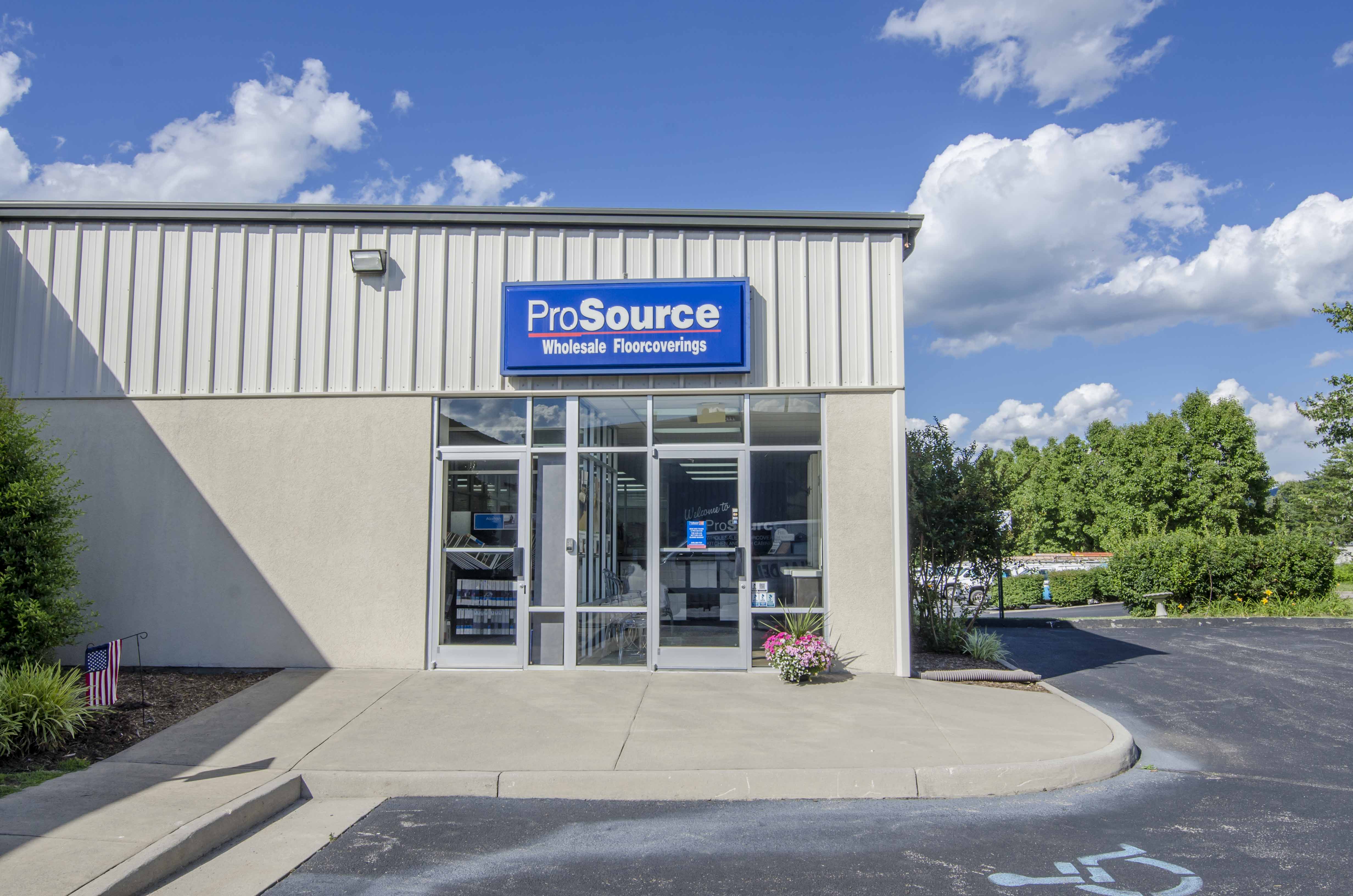 ProSource Wholesale Floorcoverings storefront with clear signage under a sunny sky.