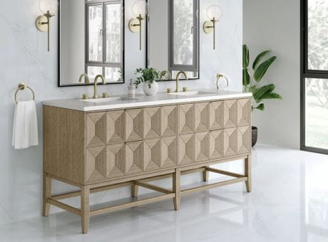 Modern bathroom vanity with wooden geometric cabinets, double sinks, brass fixtures, and elegant decor.