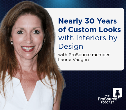 Brown-haired woman Laurie Vaughn, ProSource member, smiles in a white blouse celebrating 30 Years of Custom Looks with Interiors.