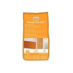 Bag of adhesive material marked 'Adhesive All-Set' suitable for flooring work and construction.