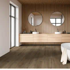 Modern bathroom with wooden double-sink vanity, two circular mirrors, a bathtub, and wood-paneled decor.