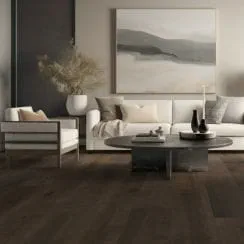 Modern living room with dark wooden flooring, white sofa, armchair, coffee table, and wall artwork.