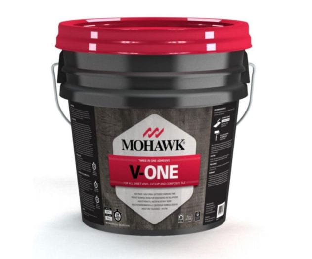 A container of Mohawk V-One adhesive, labeled for use with sheet vinyl, luxury vinyl, and composite tiles.