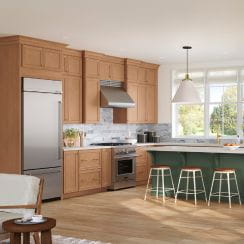 A modern kitchen featuring wooden cabinetry, a kitchen island with bar stools, and a window letting in natural light.