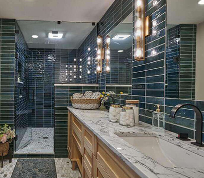 A remodeled bathroom with tile flooring