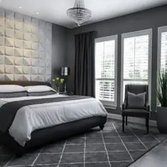 A newly remodeled bedroom with monochromatic tones