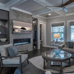 A remodeled living room with dark hardwood flooring