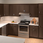 A remodeled kitchen with dark brown cabinets