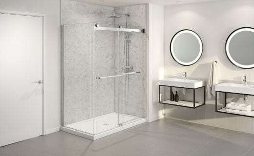 A modern bathroom with a glass shower enclosure, two round mirrors, floating vanities, and modern lighting.