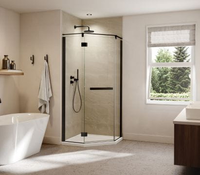 Contemporary bathroom scene with a corner glass shower enclosure, freestanding bathtub, soft lighting, and modern decor.