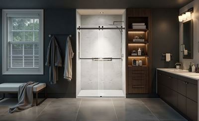 Modern bathroom showcasing a shower enclosure with sliding glass doors, wooden cabinetry, and elegant lighting.