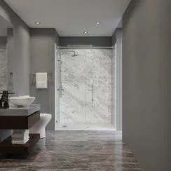 Modern bathroom with a marble shower, gray walls, and a sleek vanity.
