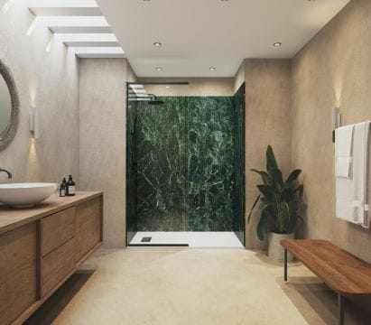 Modern bathroom with wooden vanity, green marble shower wall, and contemporary decor.