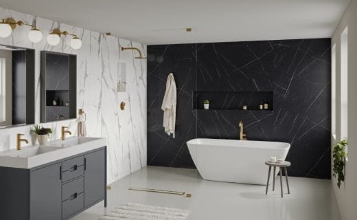 Luxurious bathroom interior with Calacatta Statuario marble walls, a freestanding bathtub, gold fixtures, and modern cabinetry.