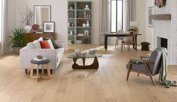 A modern, light-filled living room grounded by Mohawk TecWood engineered hardwood.