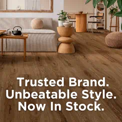 Modern living room with wooden flooring, featuring PA Preferred Coretec branding.