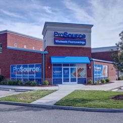 ProSource Wholesale Floorcoverings retail storefront with visible signage and brick exterior.