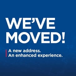 Text reading 'We've Moved! A new address, an enhanced experience' on a blue background.