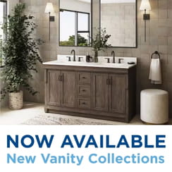 Modern bathroom with a double-sink wooden vanity and promotional text reading 'NOW AVAILABLE New Vanity Collections.'