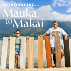 Two individuals stand outdoors holding wooden planks with a scenic background and text introducing 'Mauka to Makai'.