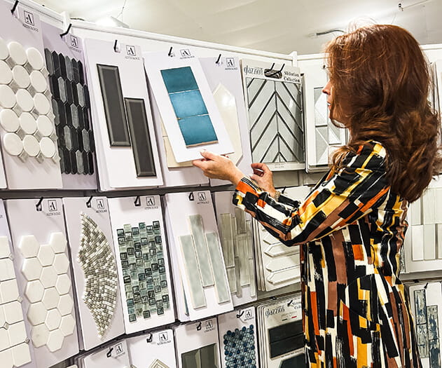 Designer browsing through tile samples