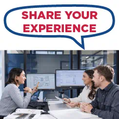 Three individuals sitting at a desk having a discussion in an office setting, with a speech bubble containing the text 'Share Your Experience'.