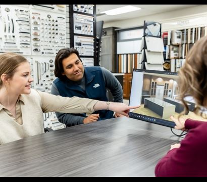 An account manager smiling at the camera in a ProSource showroom