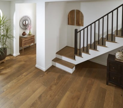 Hardwood floors near a staircase