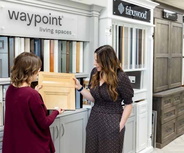 Homeowner viewing samples with their account manager in the showroom