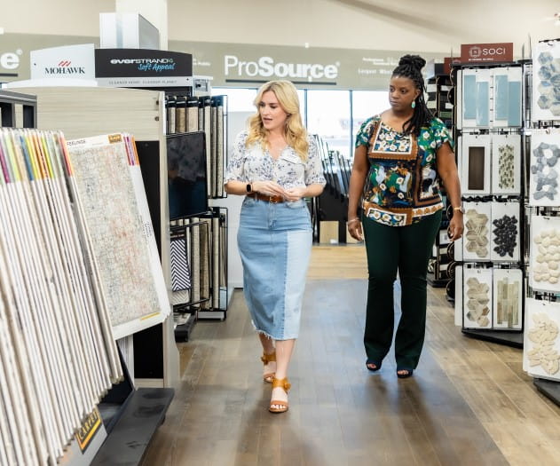 Homeowner viewing displays with their account manager in the showroom