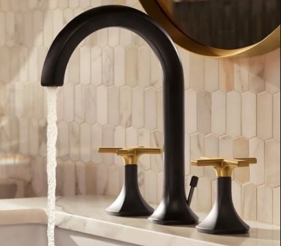Black and gold-toned bathroom sink faucet
